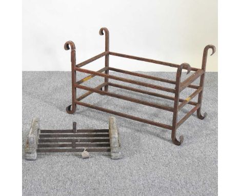 A cast iron fire grate, 76cm wide, together with a boot scraper (2)