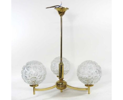 A brass three branch pendant light, with three moulded glass shades, 44cm diameter