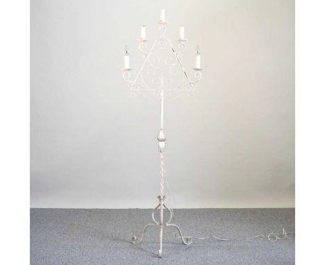 An ornate white painted wrought iron floor standing candelabra, 165cm high together with a cut glass ceiling light and a bras