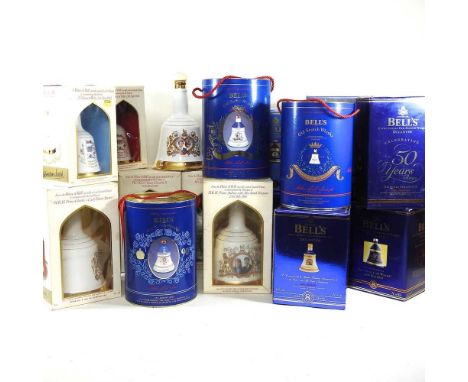 A collection of sixteen Bell's Scotch Whisky decanters, to include Royal commemorative, all boxed with contents, together wit