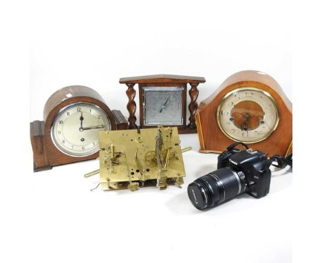 A 1930's mantel clock, together with two others, a clock movement and a Canon camera