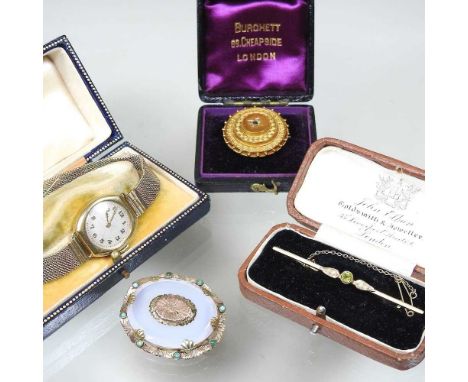 An early 20th century 9 carat gold, peridot and split pearl bar brooch, 2.3g, 6cm, cased, together with a Victorian gilt broo