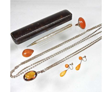 An antique 9 carat rose gold box chain, 27g, 150cm long, suspended with an amber coloured pendant, together with polished aga