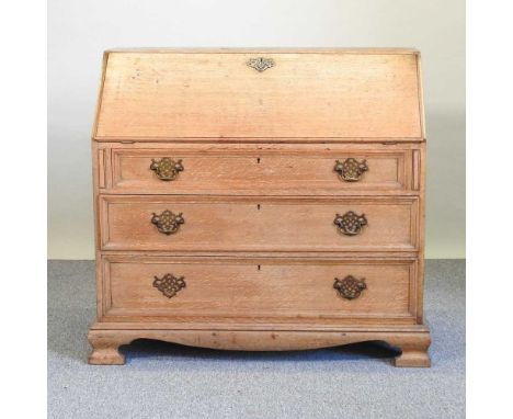A 19th century light oak bureau, on bracket feet112w x 57d x 101h cm