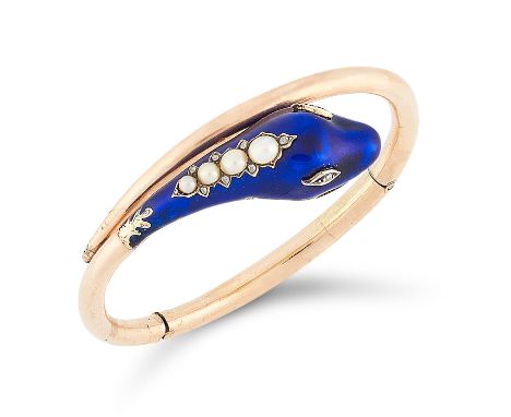 AN ANTIQUE PEARL, DIAMOND AND ENAMEL SNAKE BANGLE, 19TH CENTURY in high carat yellow gold, the articulated body terminated by