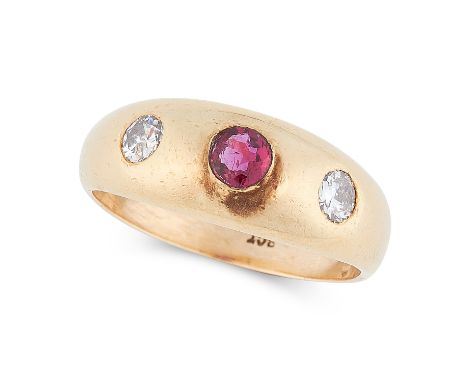 A RUBY AND DIAMOND THREE STONE GYPSY RING, CIRCA 1950 in yellow gold, the tapered band set with a central ruby between two ro