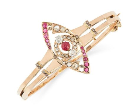 AN ANTIQUE RUBY AND DIAMOND BANGLE, LATE 19TH CENTURY in high carat yellow gold, the marquise face is set with cushion cut ru