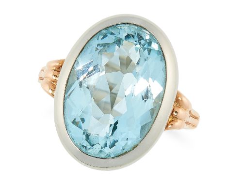 A VINTAGE AQUAMARINE DRESS RING set with an oval cut aquamarine of 6.77 carats, size P / 7.5, 7.7g.