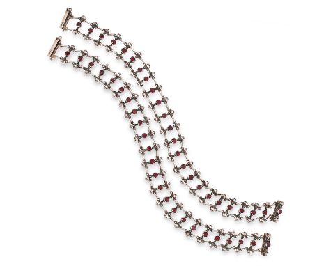 AN ANTIQUE GARNET AND ENAMEL BLACKAMOOR NECKLACE / BRACELETS comprising of two bracelets each set with a row of round cut gar