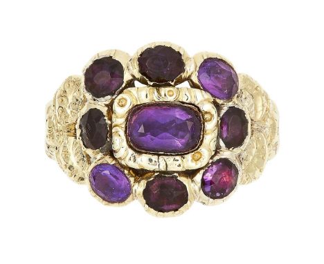 AN ANTIQUE AMETHYST MOURNING RING, CIRCA 1822 set with a cluster of oval cut amethyst, tests as 18ct yellow gold, size N / 7,