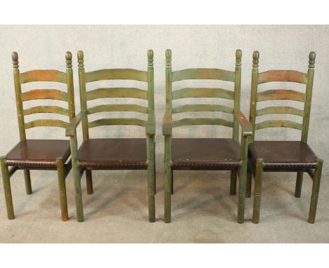 A set of four painted 19th / early 20th ladder back dining chairs, with turned finials raised on turned legs and solid seats.