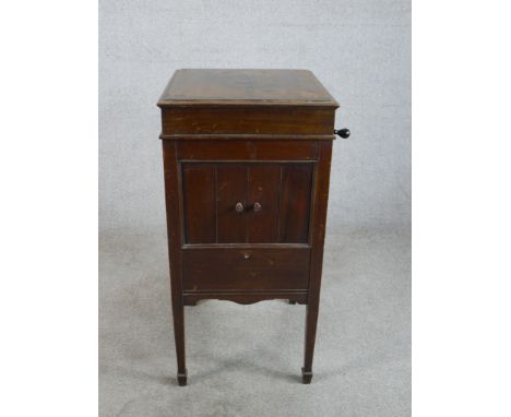 An early 20th century mahogany cased floor standing Columbia Grafonla record player with single cupboard door, raised on squa