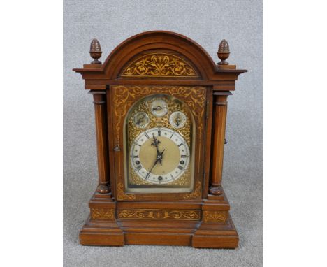 A late 19th / early 20th century inlaid oak cased dome topped Westminster chime mantle clock chime, the brass dial with three