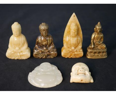 A collection of six carved Buddhas, including a bone Buddha head, jade Buddha, three carved hardstone Buddhas and a brass min