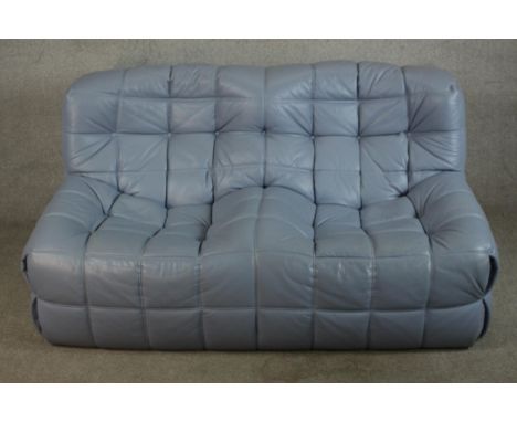 A late 20th century Togo blue leather two seater sofa designed by Michael Ducorary for Ligne Roset, with orginal label. H.75 