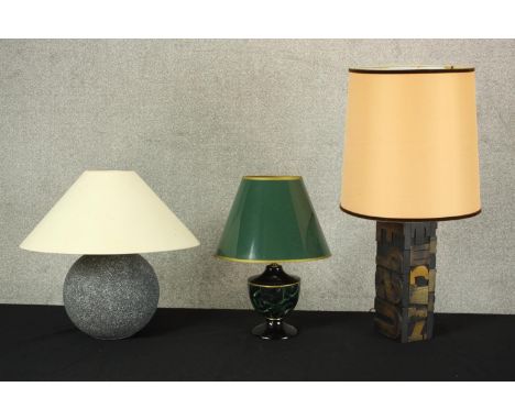 Three table lamps, including a malachite pattern lacquered metal table lamp with green shade, a carved letter printing block 