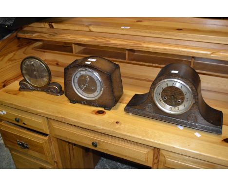 A mid 20th century oak cased mantel clock, a Napoleon hat mantel clock, and another clock.