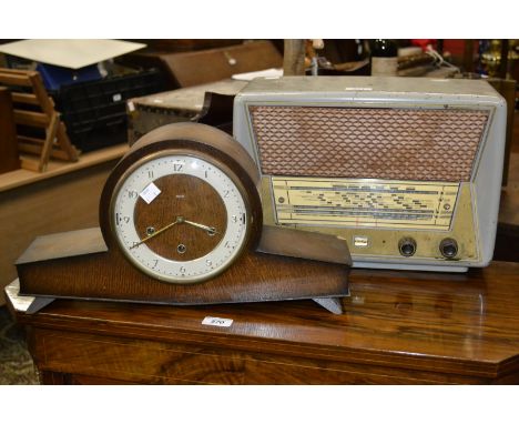 A mid 20th century Smith's oak Napoleon hat mantel clock; a Stella radio (2)