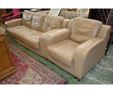 A contemporary caramel leather three seat sofa and conforming armchair.