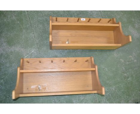 A pair of modern wall shelf units with coat hooks; another similar (3)