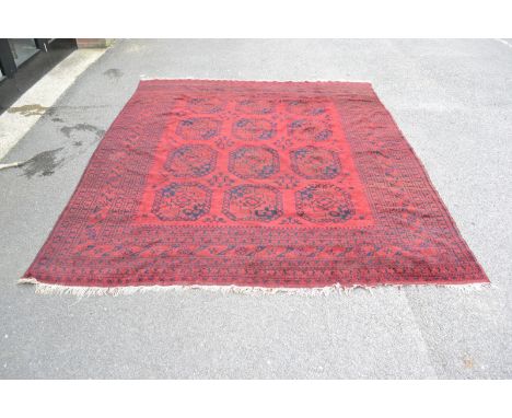 An Afghan carpet 316cm x 285cm