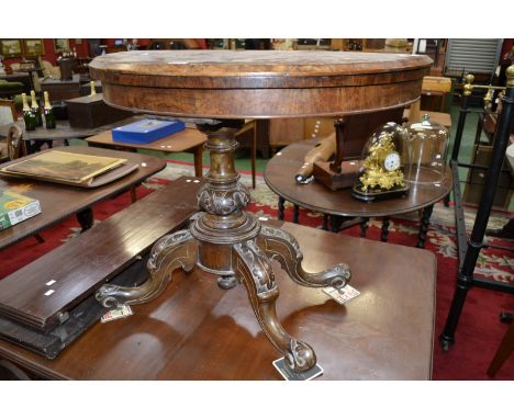 An early Victorian burr walnut demi-lune tea table, carved pedestal base, ceramic casters, c.1850.
