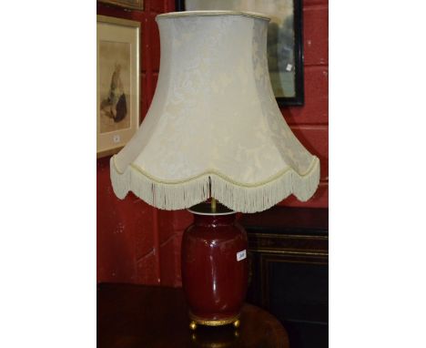 A Chinese sang-de-boeuf vase (converted to a table lamp)