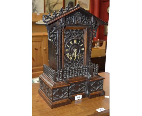 A Black Forest mantel cuckoo clock, 11cm dial applied with Roman numerals, twin winding holes, the movement striking on a gon
