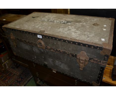 A metal bound travel trunk.
