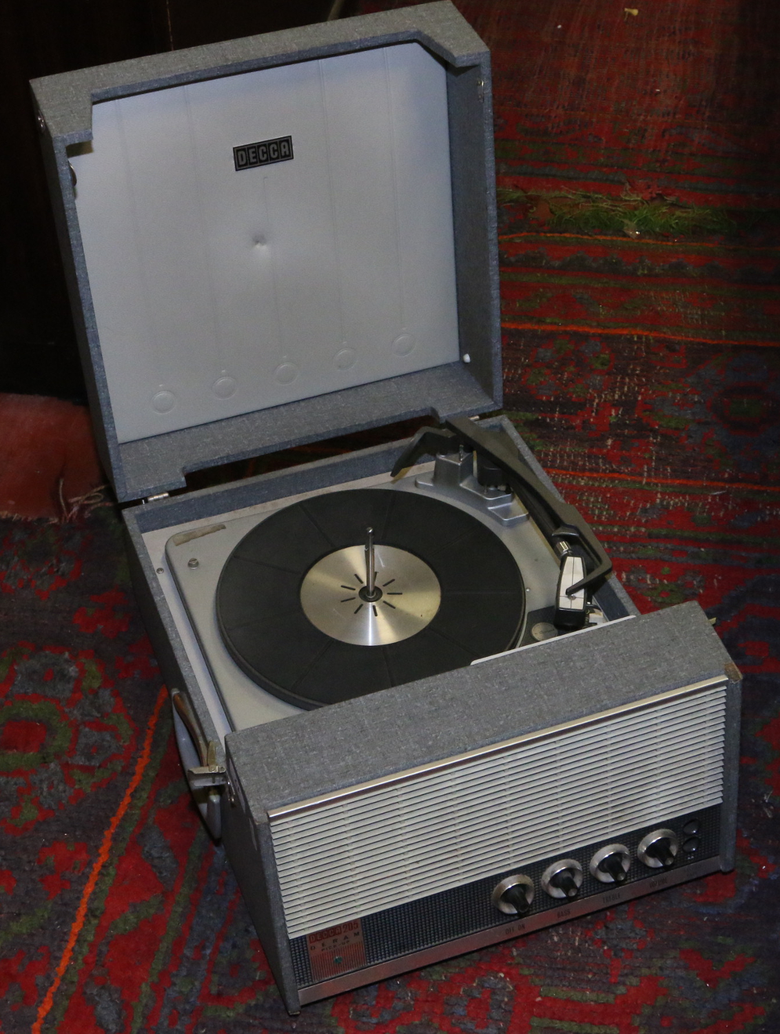 A vintage Decca 205 portable record player with Garrard turntable.