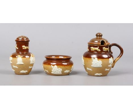 A Doulton Lambeth three part stoneware cruet set sprigged with topers and hunting hounds.