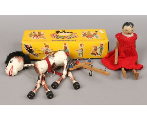 A boxed Pelham puppet, Muffin the Mule and another vintage doll.