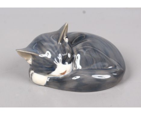 A Royal Copenhagen model of a sleeping cat.   Condition Report. To be used as a guide only.  good condition
