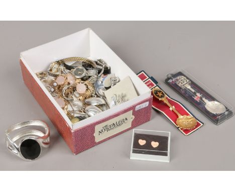 A box of costume jewellery to include watches, bracelets, necklaces, collectors spoons and a Wade whimsie cockerel.