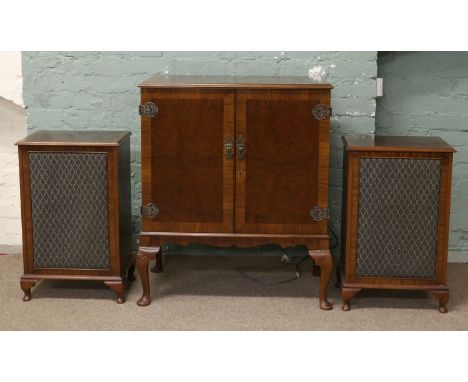 A carved mahogany and burr walnut hifi cabinet raised on cabriole legs fitted with Dynatron GL78 stereo transcription turn ta