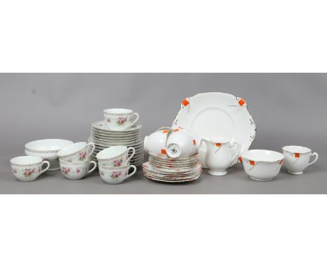 A Bavaria china part tea service decorated with roses, along with a standing Art Deco china service.