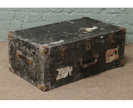A painted tin trunk.