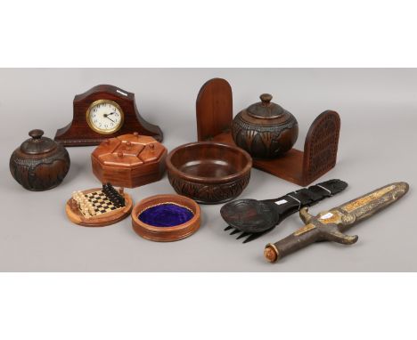 A collection of wooden items to include oak mantel clock, carved book ends, miniature chess set etc.