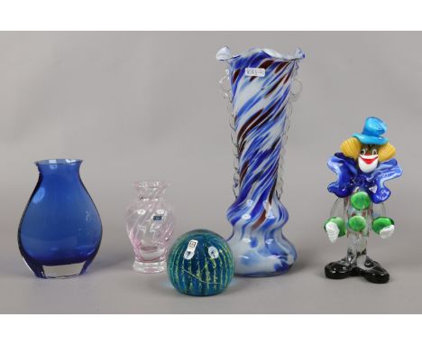 A group of decorative glass items including a Mdina paperweight, Caithness vase, Murano style model of a clown etc.