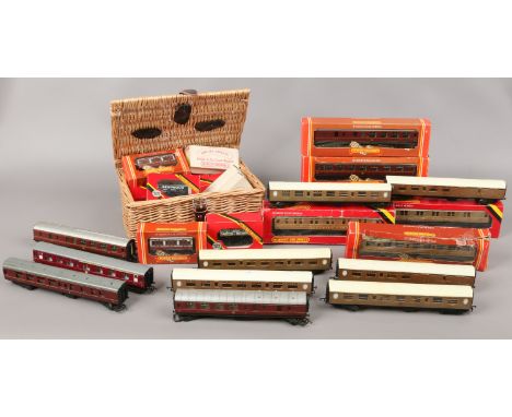 A basket and loose example of boxed and unboxed Hornby oo gauge model railway carriages and wagons to include LMS, LNER and s