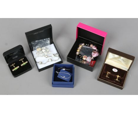 A collection of costume jewellery to include Swarovski pendant and chain, charm bracelet, two pairs of cufflinks, Murano brac