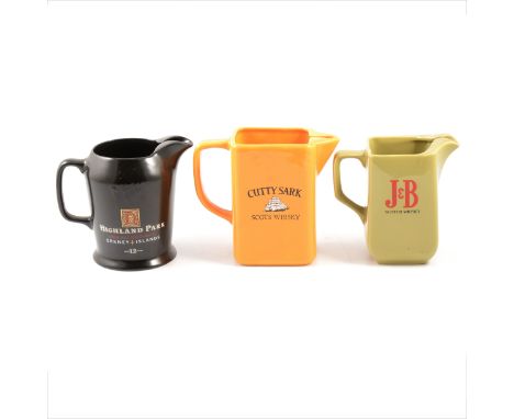 Twenty-one ceramic water jugs, whisky branded, and other whisky branded ceramics and glassware.Qty: (2 boxes)