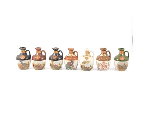 Thirteen assorted Rutherford's ceramic decanters, blended 12 year old Scotch whisky, including twelve 18.75cl, 40%; and one l