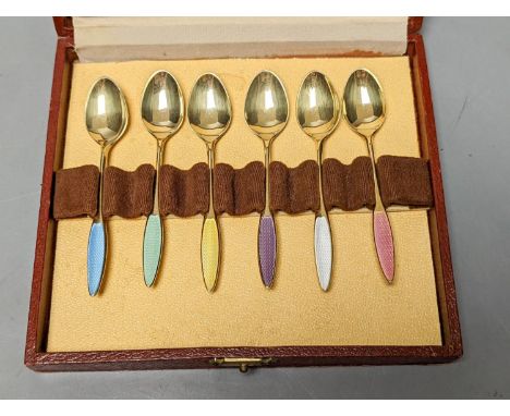 A cased set of six Danish Fricast gilt sterling and enamel coffee spoons.