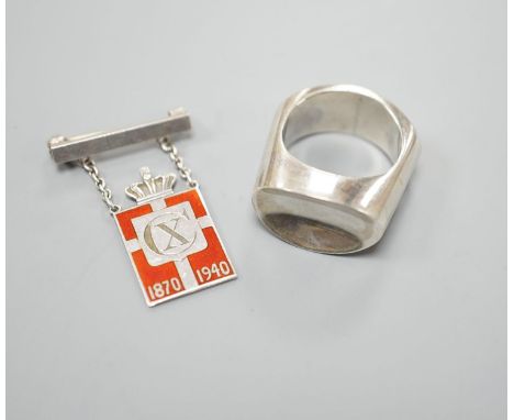 A Georg Jensen sterling ring, no. A11O B,  size Q and a Georg Jensen 925 and enamel CX 1870-1940 King Christian drop brooch, 