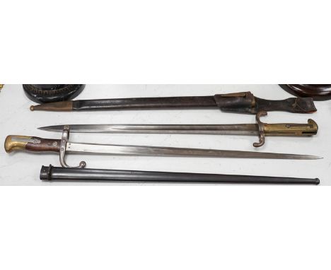 A French bayonet and scabbard with matching serial number (38804) and inscription and date to back of blade (1879) and anothe