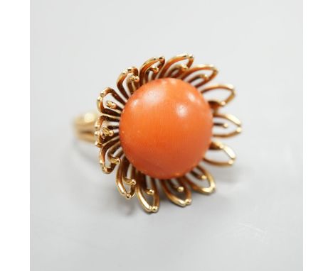 A modern yellow metal and button shaped coral bead set dress ring, size L, gross weight 13.4 grams.