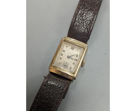 A gentleman's 1930's 9ct gold rectangular dial manual wind gold wrist watch.