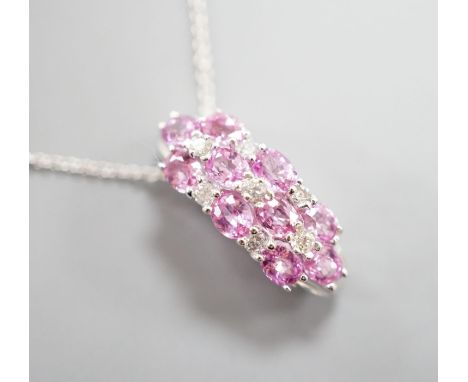 A modern 14k white meta. pink sapphire and diamond cluster set pendant, on a 14k fine link chain(knotted),pendant 20mm, gross