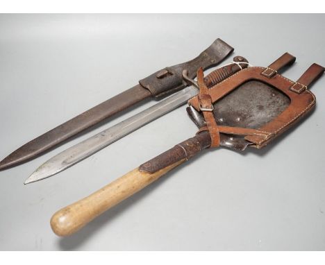 A WWI German pioneer's spade, in leather mount, and a H.Mundeos &amp; Co. bayonet with scabbard